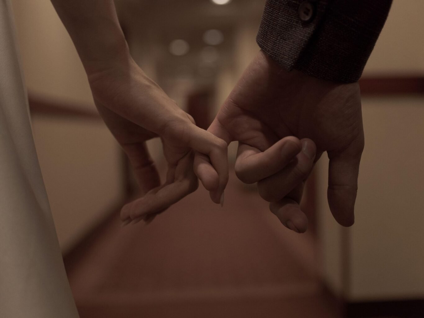 This Image Shows A Couple Holding Hands