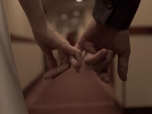 This Image Shows A Couple Holding Hands