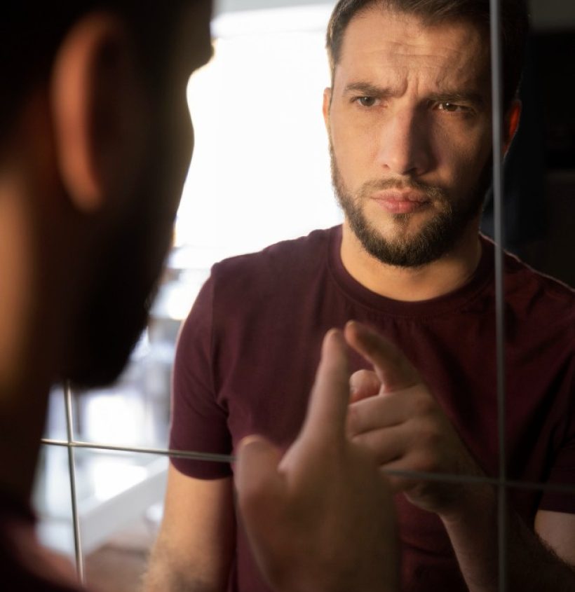 side-view-anxious-man-looking-mirror