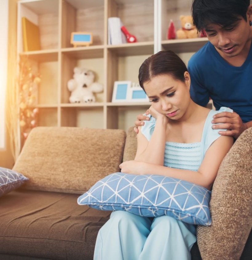 young-couple-serious-living-room